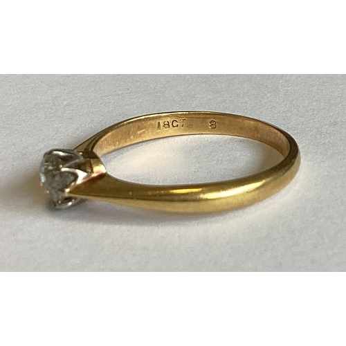 842 - An 18 carat gold mounted single stone ring in claw setting. Approx. 3 grams. Est. £80 - £120.
