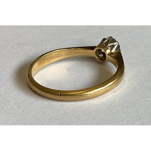 842 - An 18 carat gold mounted single stone ring in claw setting. Approx. 3 grams. Est. £80 - £120.