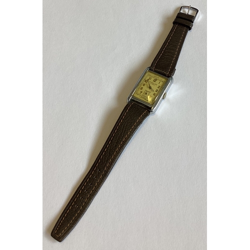 959 - HORNET AEROPLANE: A gent's rectangular stainless steel wristwatch on leather strap. Est. £30 - £50.