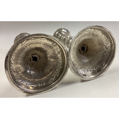 105 - A pair of 17th / 18th Century Queen Anne silver tapersticks. Circa 1700. Approx. 245 grams. Est. £60... 