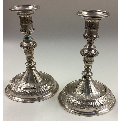 105 - A pair of 17th / 18th Century Queen Anne silver tapersticks. Circa 1700. Approx. 245 grams. Est. £60... 