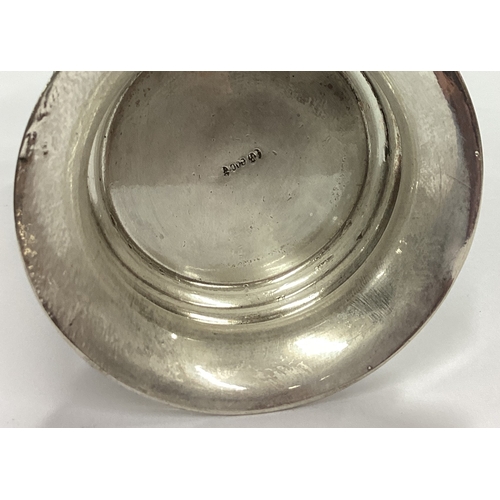 111 - A German silver beaker with coin inserts. Approx. 200 grams. Est. £300 - £400.