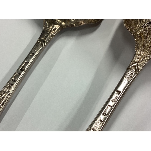 118 - A pair of 18th Century bottom marked silver spoons. Approx. 122 grams. Est. £100 - £150.