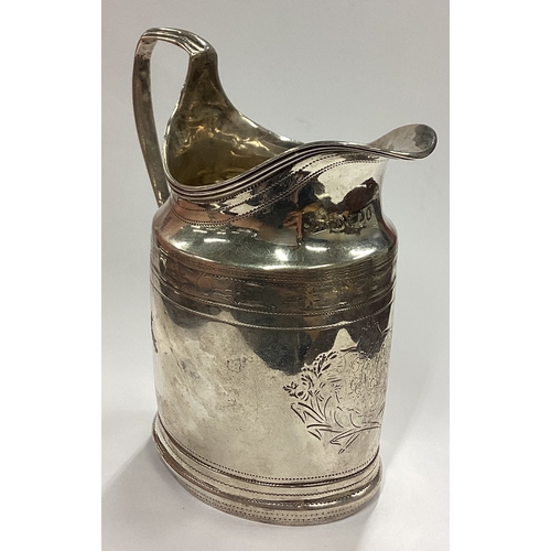 126 - A Georgian silver cream jug with bright-cut decoration. London 1796. By Solomon Hougham. Approx. 124... 