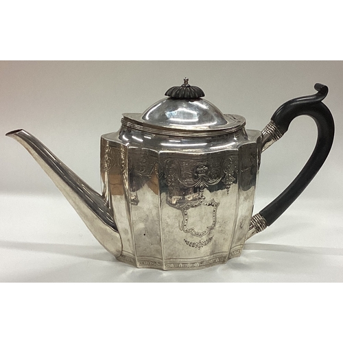 129 - An 18th Century Georgian silver teapot with bright-cut decoration. London 1788. By John Robins. Appr... 