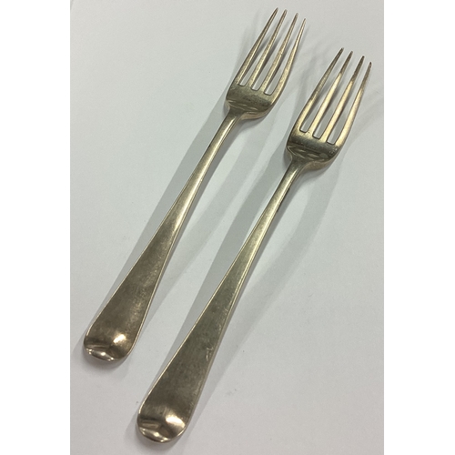 133 - A pair of Antique early 19th Century silver wine coasters together with two forks. Possibly Maltese?... 