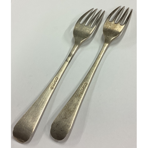 133 - A pair of Antique early 19th Century silver wine coasters together with two forks. Possibly Maltese?... 