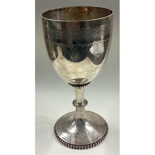 14 - A large Victorian silver presentation goblet / chalice. London 1876. By Charles Boyton. Approx. 374 ... 