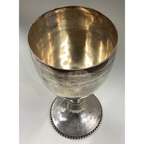 14 - A large Victorian silver presentation goblet / chalice. London 1876. By Charles Boyton. Approx. 374 ... 