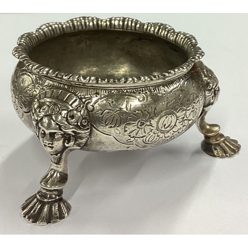 142 - An early silver salt cellar on feet with chased figures to each foot. London 1745. By Edward Wakelin... 