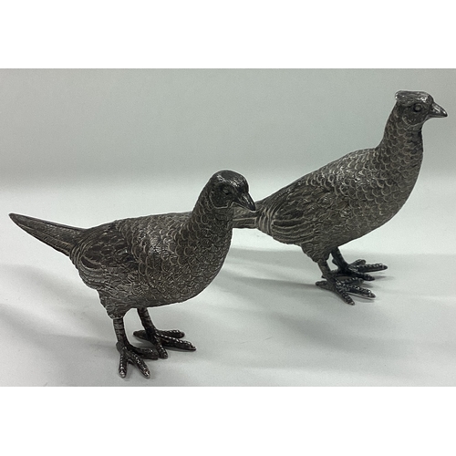 146 - A fine pair of silver figures of pheasants. Import marked to tails. Approx. 387 grams. Est. £600 - £... 