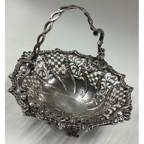 15 - An 18th Century Georgian silver swing handled basket with pierced decoration. London 1763. Approx. 1... 