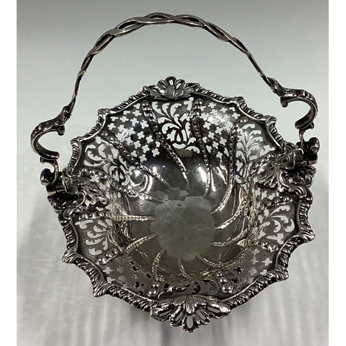 15 - An 18th Century Georgian silver swing handled basket with pierced decoration. London 1763. Approx. 1... 