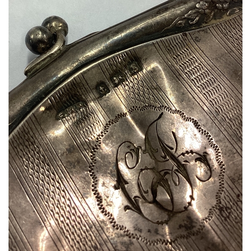 154 - A large engine turned silver purse. Birmingham 1917. Approx. 79 grams. Est. £40 - £60.