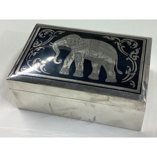 16 - A silver and Niello jewellery box with lift-off cover and elephant decoration. Marked to base. Appro... 