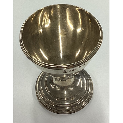 164 - An 18th Century Georgian silver egg cup. London 1719. By Charles Hougham. Approx. 41 grams. Est. £80... 