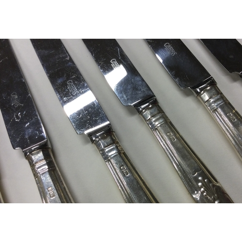 168 - CARRS: A rare set of twelve plus twelve silver King's pattern table and dessert knives. Sheffield 19... 