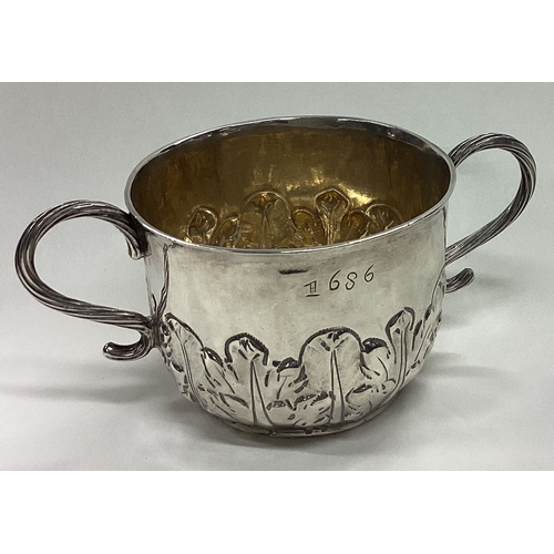 169 - An early 17th Century silver porringer. London 1683. Approx. 100 grams. Est. £800 - £1200.