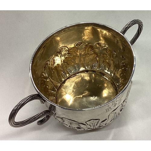 169 - An early 17th Century silver porringer. London 1683. Approx. 100 grams. Est. £800 - £1200.