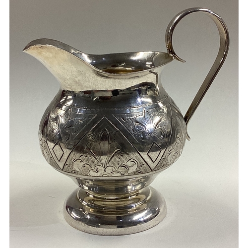 17 - A 19th Century Russian silver jug with chased decoration. 1884. Marked to base. Approx. 133 grams. E... 