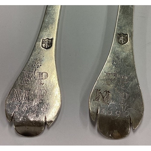 170 - EXETER: An oversized pair of 17th Century silver trefid spoons. Dated 1696 and 1698. By Thomas Salte... 