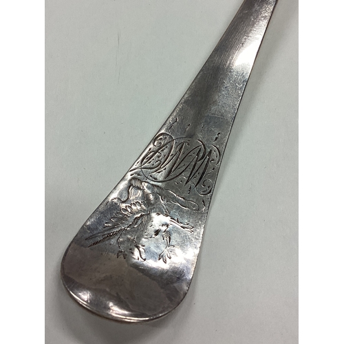 177 - A large 18th Century silver rat tail serving spoon. London 1727. By Walter Tweedie. Approx. 129 gram... 