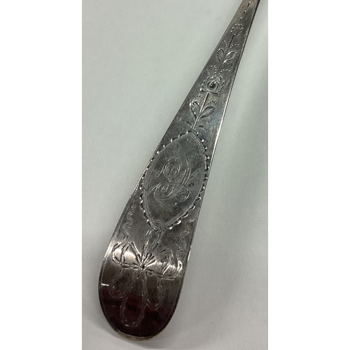 178 - DUBLIN: A large 18th Century Irish silver serving spoon with bright-cut decoration. 1772. By Michael... 