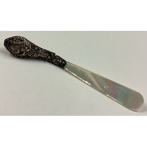 20 - A silver and MOP letter opener. Birmingham 1915. Approx. 15 grams. Est. £10 - £20.