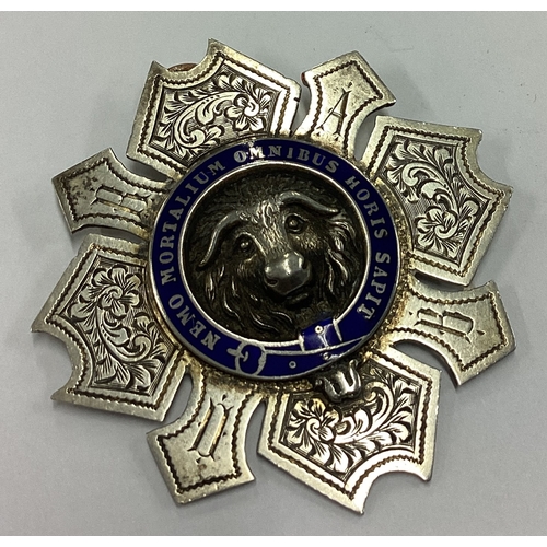 203 - An early silver and enamelled medallion chased with cow decoration to centre. London 1903. Approx. 2... 