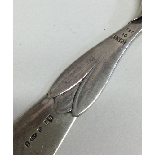 217 - A miniature silver knife of stylised form. Approx. 28 grams. Est. £50 - £80.