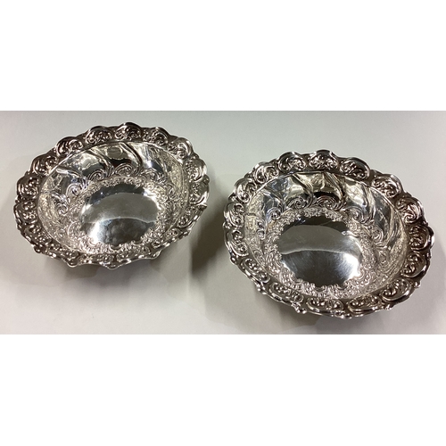 226 - A fine pair of cased Victorian silver bowls with chased decoration. Sheffield 1898. By Henry Wilkins... 