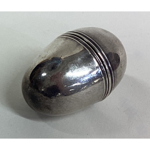 298 - A small plain Georgian silver egg shaped nutmeg grater of typical form. By SM. Approx. 11 grams. Est... 