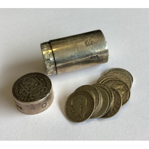 323 - A silver counter box with coins inside bearing import marks. Approx. 43 grams of gross weight. Est. ... 