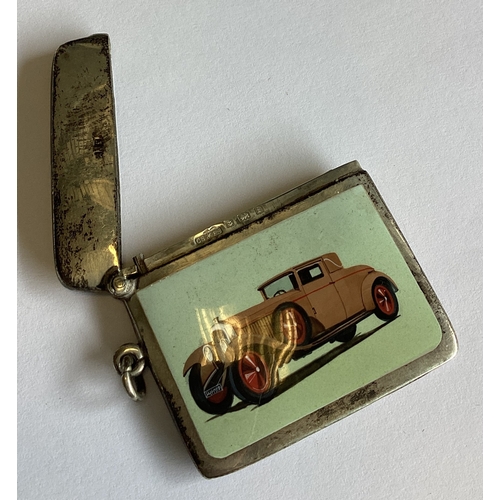 355 - A rare silver and enamelled vesta case decorated with a car. Birmingham 1905. Approx. 31 grams. Est.... 