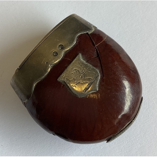 359 - A Victorian silver vesta case in the form of a Brazil nut. Birmingham 1884. By George Unite. Approx.... 