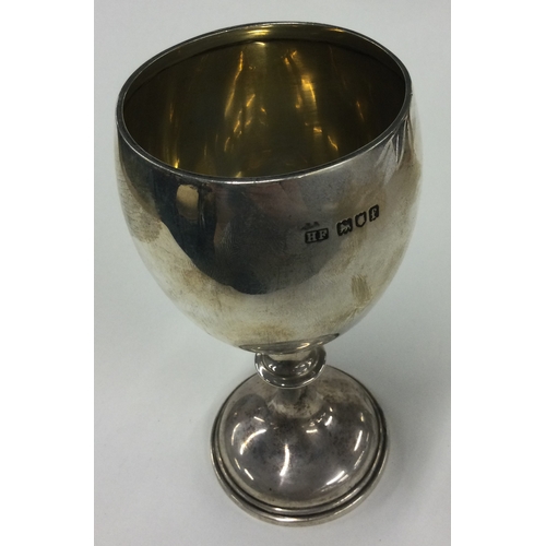 368 - OF CIVIL SERVICE INTEREST: A silver goblet with chased armorial decoration. London 1901. By Henry Fr... 