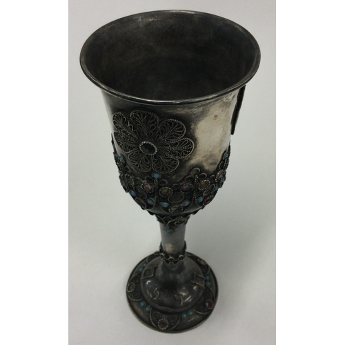 369 - A rare Judaica silver goblet set with stones. Marked to base. Approx. 101 grams. Est. £120 - £150.