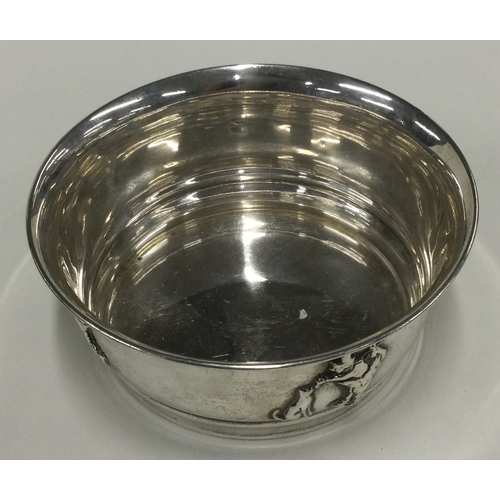 373 - A silver christening bowl with chased decoration. Birmingham 1923. Approx. 129 grams. Est. £120 - £1... 