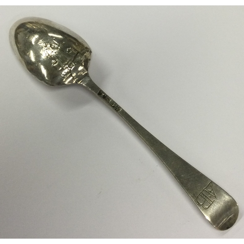 380 - An early Georgian silver picture back spoon chased with figure of a farmhand. Circa 1770. By Thomas ... 