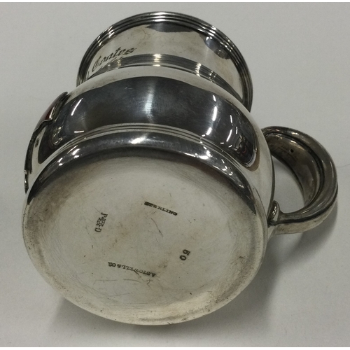 386 - A silver and enamelled mug embossed with American and Australian flags. Marked Sterling to base. App... 