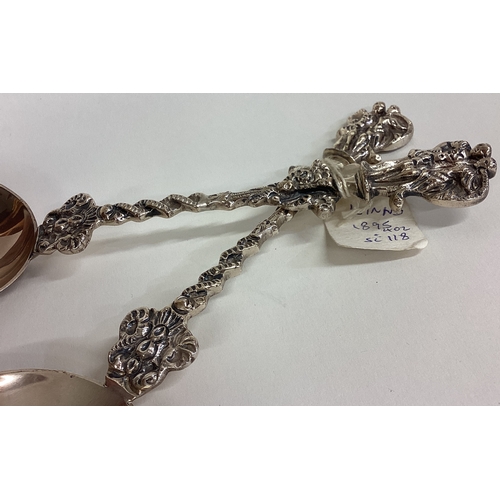 41 - A heavy pair of cast silver preserve spoons. London. By S&H. Approx. 134 grams. Est. £80 - £120.