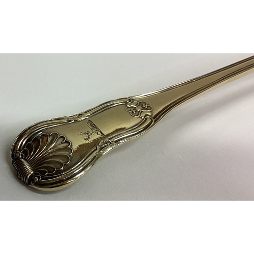 421 - A heavy fine quality silver gilt hour glass pattern basting spoon. London. By WE,WF&WC. Approx. 211 ... 