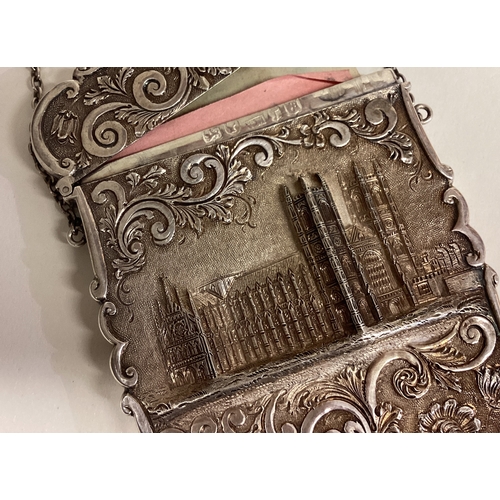 429 - A silver castle top card case with hinged lid decorated with flowers and scrolls depicting Westminst... 