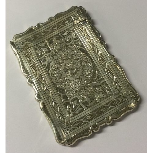 430 - A Victorian silver card case with engraved decoration. Birmingham 1893. By Frederick Marsden. Approx... 