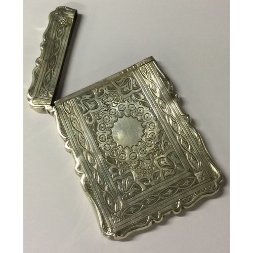 430 - A Victorian silver card case with engraved decoration. Birmingham 1893. By Frederick Marsden. Approx... 