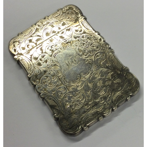 430 - A Victorian silver card case with engraved decoration. Birmingham 1893. By Frederick Marsden. Approx... 