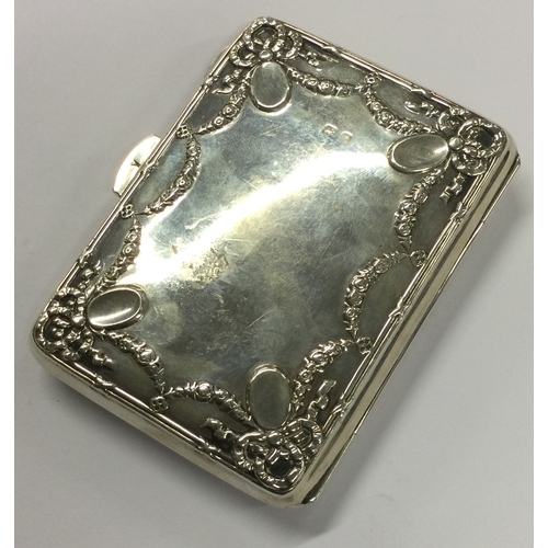 442 - A silver card case with hinged cover and engraved decoration. Birmingham 1909. Approx. 83 grams. Est... 