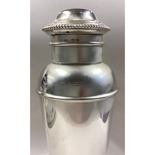 456 - A rare Art Deco silver cocktail shaker with double skinned detachable cover. Birmingham 1929. By Wal... 