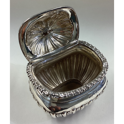 458 - A fluted silver tea caddy with hinged cover. London 1898. By Mappin & Webb. Approx. 194 grams. Est. ... 