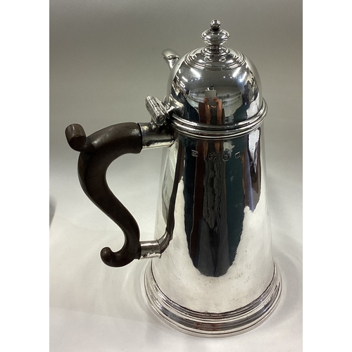 460 - A rare George I silver side-handled chocolate pot with central armorial. London 1727. By Hugh Arnett... 